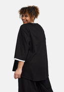 Blusa 'Saria' – assimétrica, leve e natural